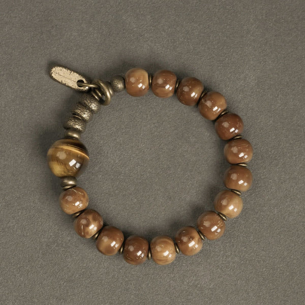 Brown beaded bracelet with focal bead and toggle detail