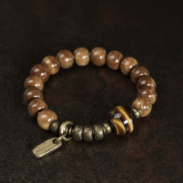Brown beaded bracelet with central bead, product view