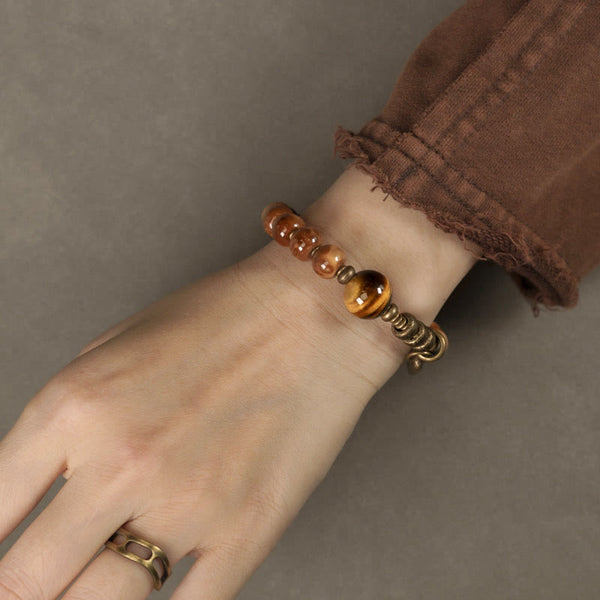 Brown beaded bracelet, wrist close-up