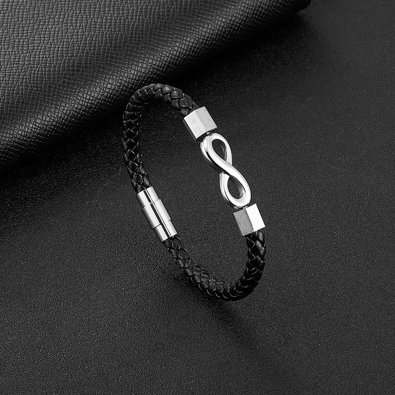 Endless Knot Titanium Steel Leather Bracelet – Silver infinity clasp black leather bracelet on textured black leather with pebble grain, monochromatic