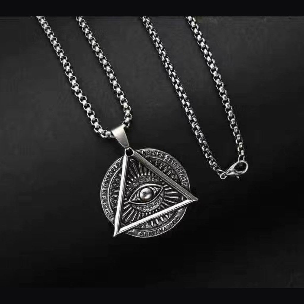 Men's Triangle Evil Eye Necklace – Studio front of the 35 mm triangle pendant and snake chain on black, men's jewelry