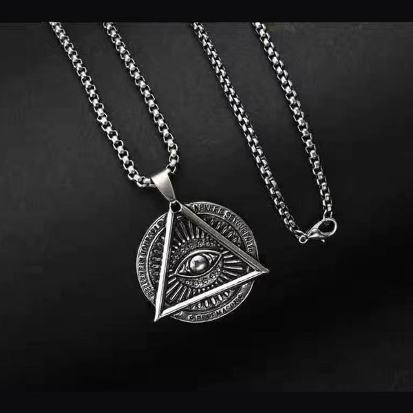 Men's Triangle Evil Eye Necklace – Studio front of the 35 mm triangle pendant and snake chain on black, men's jewelry