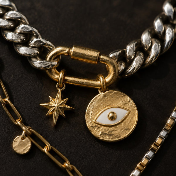 Mixed Metal Layered Charm Necklace – Macro of hammered gold eye disc, starburst and curb links