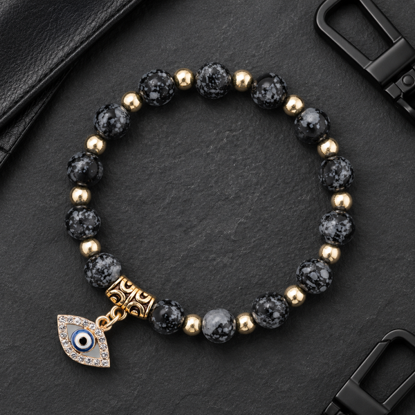 Black Snowflake Obsidian Evil Eye Bracelet - flat lay