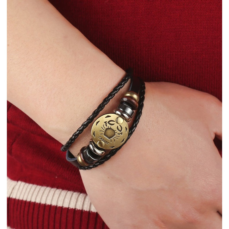 Punk Alloy Leather Zodiac Bracelet – Cancer worn on wrist, lifestyle shot with red sweater