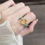 Citrine Aventurine Ring – Citrine double-point crystal with green aventurine beads worn on finger, wealth feng shui ring