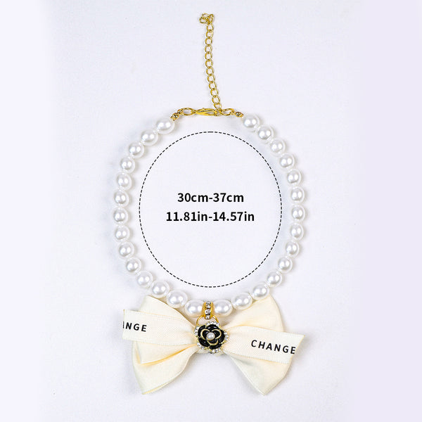 Luxury Crystal Pet Necklace – pearl strand with black camellia flower medallion, ivory satin bow, 30-37cm