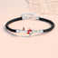 Koi Bracelet – black braided cord with silver koi fish charm and red enamel details