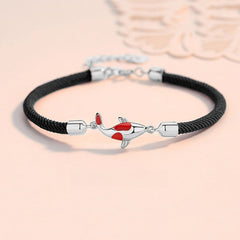 Koi Bracelet – black braided cord with silver koi fish charm and red enamel details