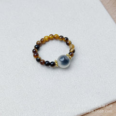 Tiger Eye Beaded Ring – Tiger eye beads with gray agate center stone on white, protection crystal ring