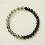 Obsidian Green Phantom Bracelet – top-down view with black obsidian and green phantom quartz beads