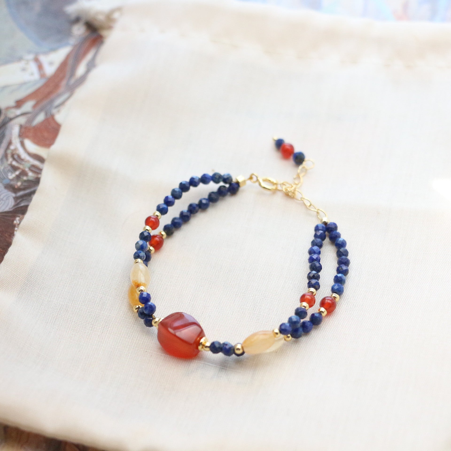 Lapis Lazuli Agate Bracelet – layered blue lapis bracelet with red agate and honey crystal beads, gold chain details, Dunhuang inspired
