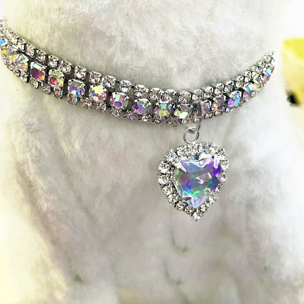 AB Crystal Pet Collar – Iridescent rhinestone band with heart pendant on white pet, aurora borealis dog jewelry