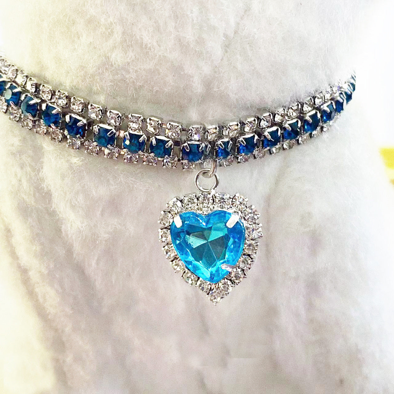 Blue Crystal Pet Collar – Square-cut blue & clear rhinestone band with heart pendant, on faux fur, luxury pet