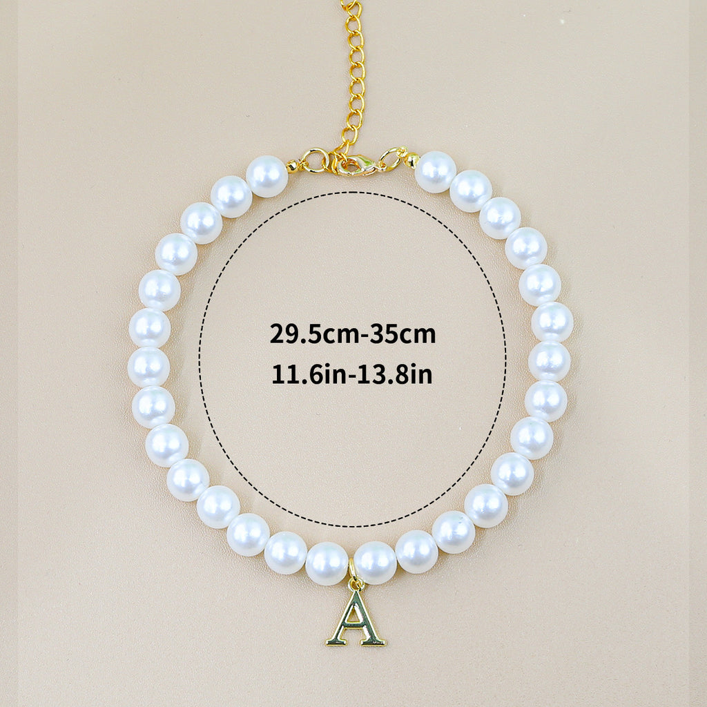 Luxury Crystal Pet Necklace – single pearl strand with gold letter A pendant, adjustable 29.5-35cm, beige backdrop