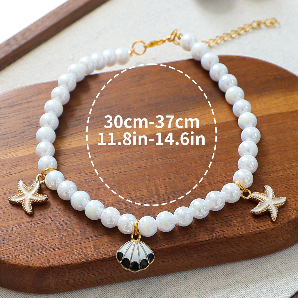 Luxury Crystal Pet Necklace – pearl strand with starfish and seashell charms, white enamel, wood tray, 30-37cm