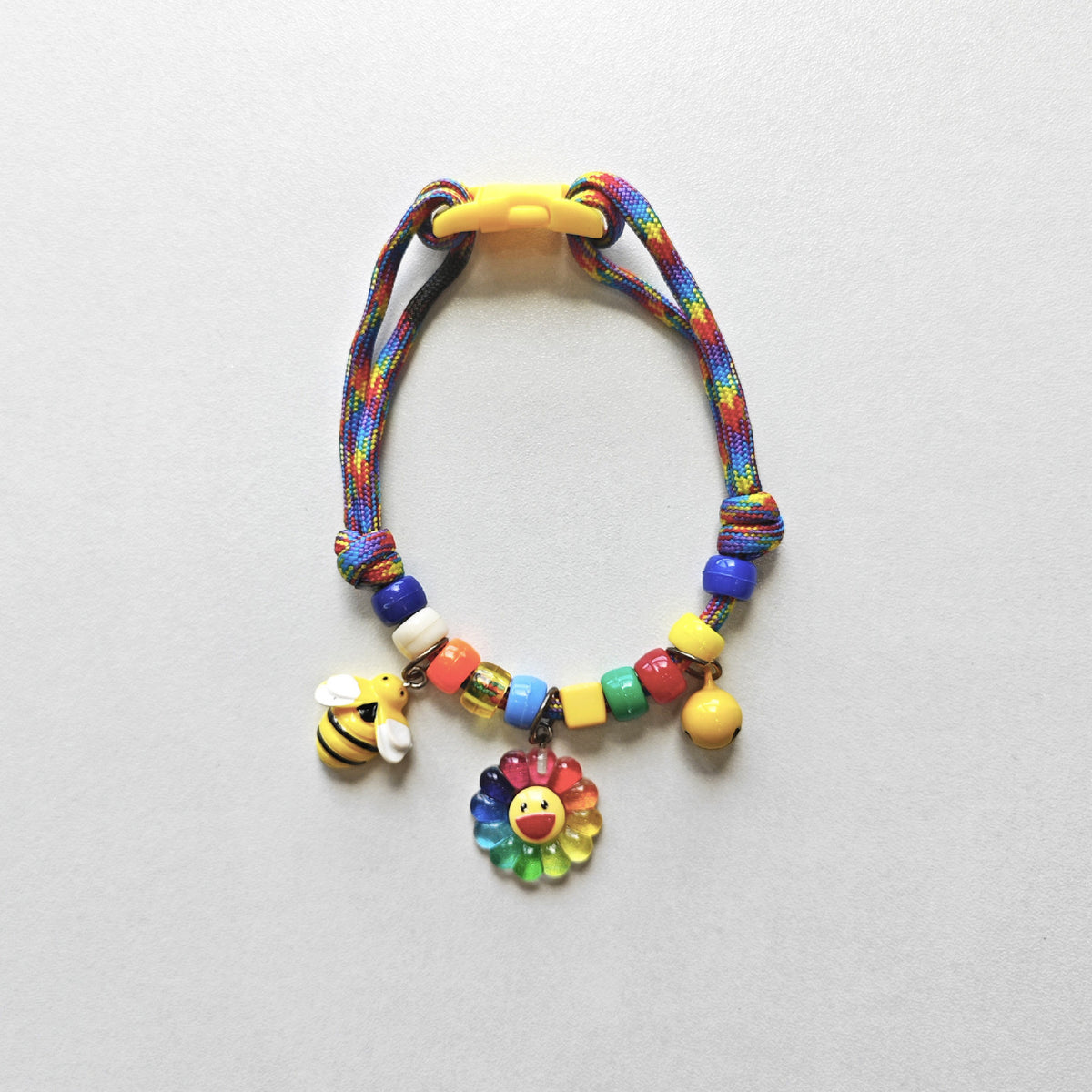 Adjustable Cat Collar – Rainbow rope with bee, rainbow flower & yellow bell, nature kawaii collar