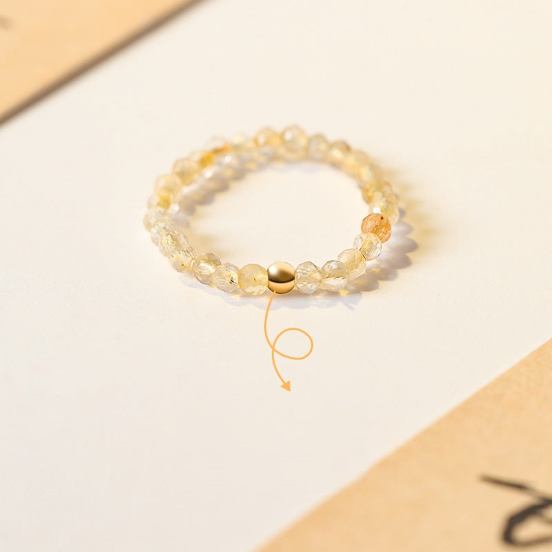 2mm Citrine Ring – Tiny faceted citrine beads with gold accent bead on cream paper, feng shui wealth jewelry Main image