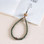 Zodiac Wood Bead Lanyard – Green sandalwood beaded phone strap with carved lotus top on white book, Zen fortune accessory