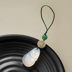 Chalcedony Gourd Keychain – icy white chalcedony gourd with green bead and fortune symbol disc