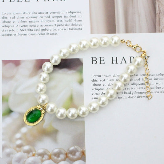 Pearl Pet Necklace – White pearl strand with emerald pendant on magazine, gold bezel, chic feng shui pet collar