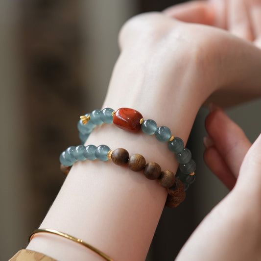 Blue Feicui Jade Two-Row Bracelet – wrist shot with blue jade, red agate, agarwood beads, gold spacers