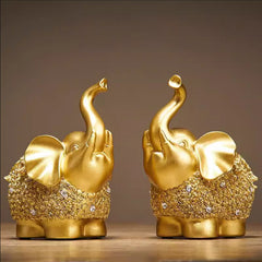 Lucky Elephant Statue – two golden crystal-studded elephants with raised trunks on wood, wealth statue