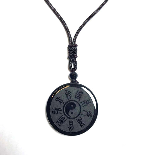 Yin Yang Pendant – white background hanging obsidian Bagua disc with knotted cord necklace