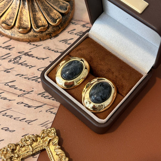 Amethyst Stud Earrings – dark blue oval stone stud earrings in gold setting inside brown velvet jewelry box with vintage letter, gift box