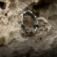 Self-Discipline Ring – Oxidized silver open cuff with sun detail on rocky surface, willpower ring