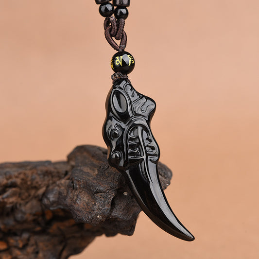 Obsidian Pendant – wolf tooth shape with beast face carving, curved pointed tip, polished black obsidian, warrior protection charm