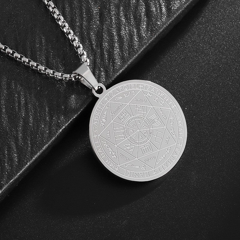 Seven Archangels Pendant – Silver seal of seven archangels on black textured surface, occult jewelry