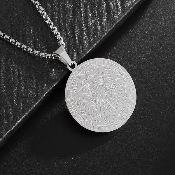Seven Archangels Pendant – Silver seal of seven archangels on black textured surface, occult jewelry