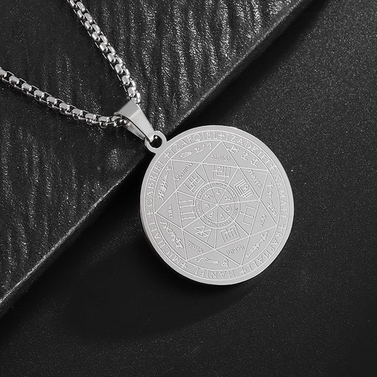Seven Archangels Pendant – Silver seal of seven archangels on black textured surface, occult jewelry