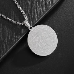 Seven Archangels Pendant – Silver seal of seven archangels on black textured surface, occult jewelry