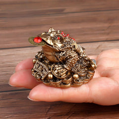 Bronze Money Toad – antique copper frog in hand for size reference textured skin detail, wealth feng shui