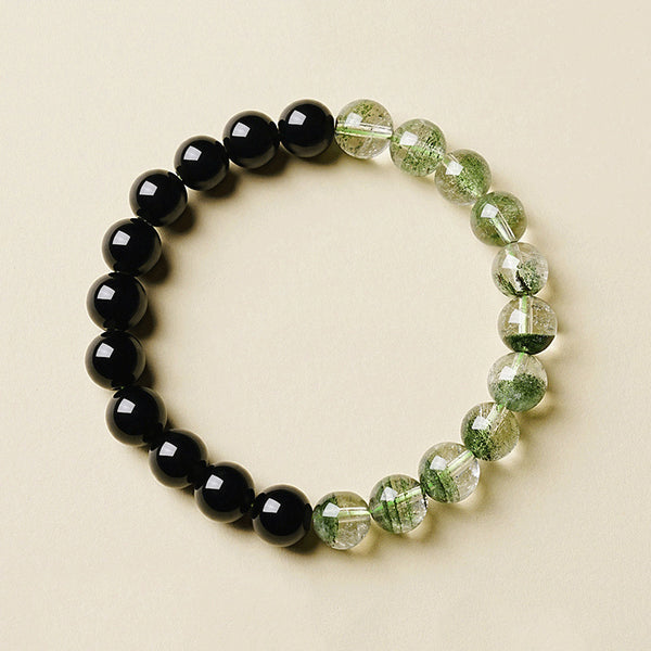Obsidian Green Phantom Bracelet – flat lay on cream background showing obsidian and phantom quartz