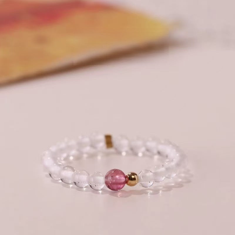 Quartz Tourmaline Ring – Clear white quartz bead ring with pink tourmaline center and gold spacers, healing ring
