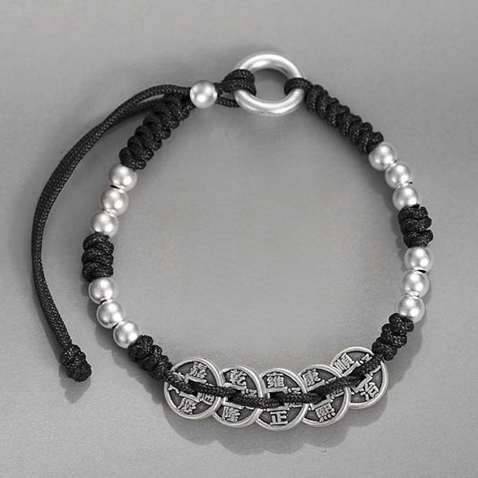 Emperor Coins Bracelet – black cord bracelet with five silver emperor coins and silver bead accents on grey background, protection jewelry