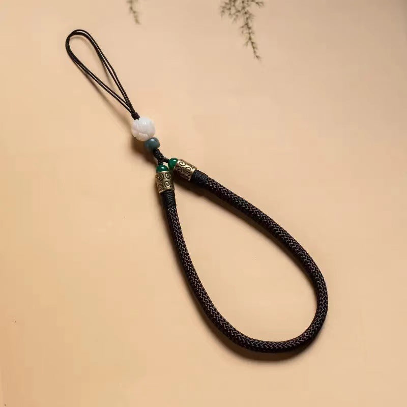 Lotus Bodhi Lanyard – Brown braided wrist strap with white lotus bead and vintage bronze fittings, earth tone phone lanyard