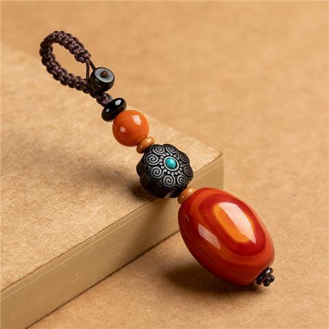 Red Agate Car Keychain – red agate with black sandalwood flower and turquoise center on beige, Tibetan style keychain