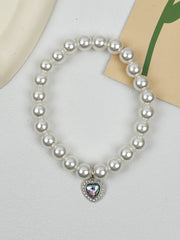 Quartz Heart Pearl Pet Collar – Pearl collar with iridescent AB heart crystal on white fabric, pet accessory