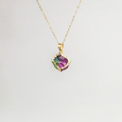 Gemstone Chip Pendant – Purple-green fluorite raw crystal cube in gold frame on chain, white background