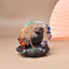 Rainbow Crystal Money Tree – copper wire tree with multicolor gems on dark lotus base, beige setting, Feng Shui charm