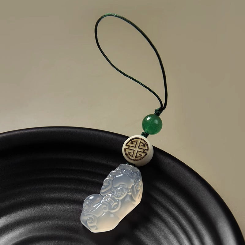 Chalcedony Pixiu Keychain – carved pixiu pendant with green jade bead on black ripple plate