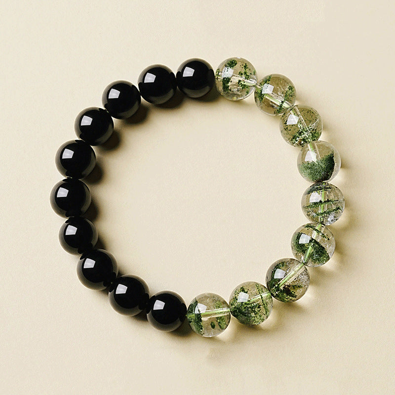 Obsidian Green Phantom Bracelet – angled flat lay with glossy black obsidian and green quartz beads
