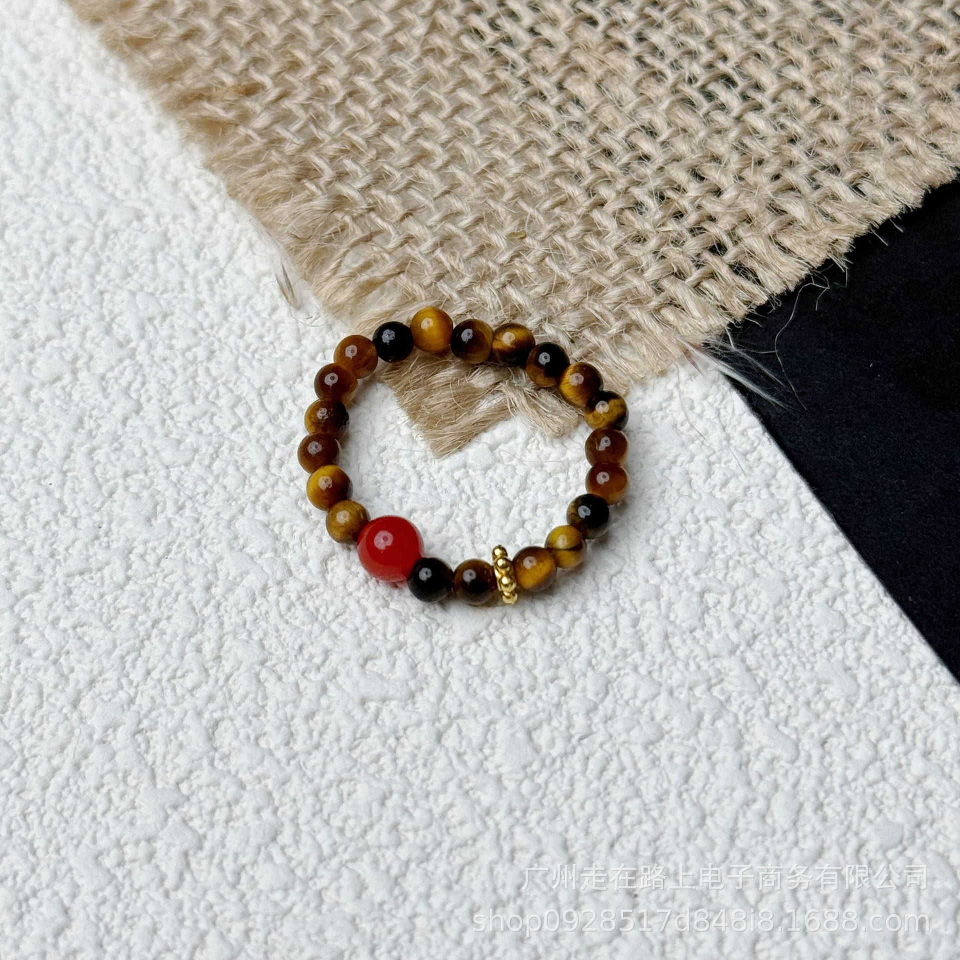 Tiger Eye Beaded Ring – Tiger eye beads with red agate accent on textured white and burlap, energy ring