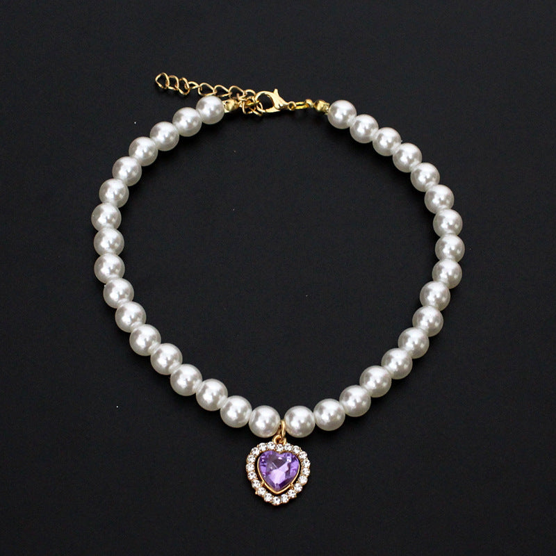 Crystal Heart Pet Necklace – Pearl collar with purple heart crystal pendant bordered with small rhinestones