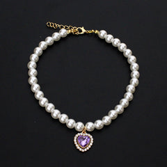 Crystal Heart Pet Necklace – Pearl collar with purple heart crystal pendant bordered with small rhinestones