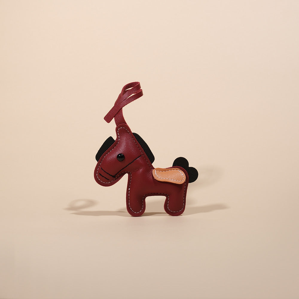 Feng Shui Leather Horse Keychain – Burgundy PU leather horse with black mane and tan saddle, bag accessory